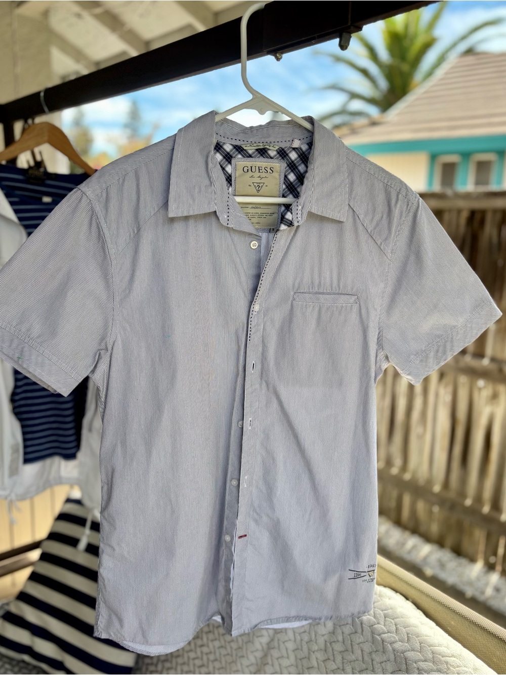 GUESS Men's Light Blue Short Sleeve Button-Down Shirt with Subtle Stripes
